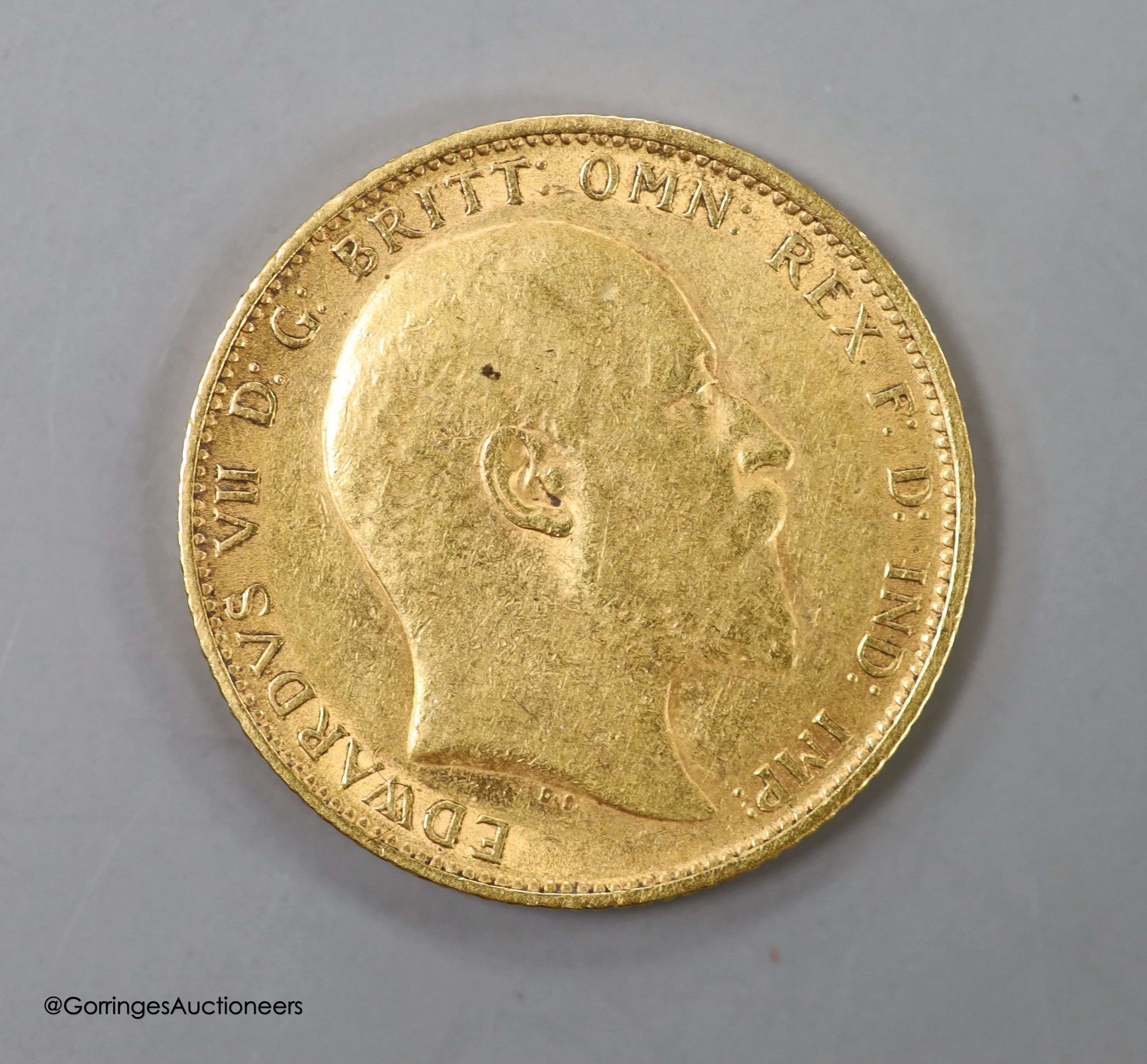 An Edward VII 1904 gold sovereign.